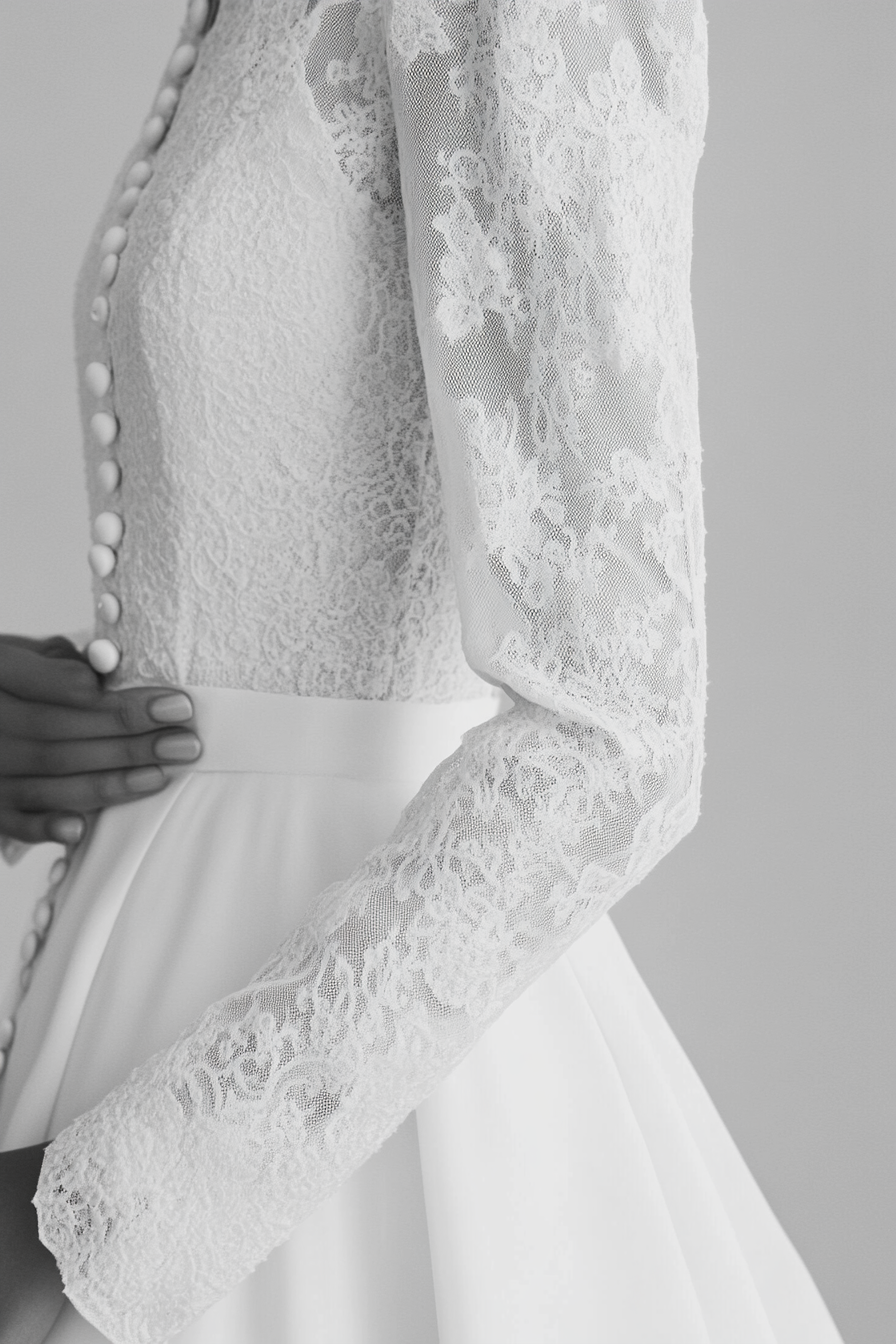 Wedding dress collection. Ballgown silhouette with Chantilly lace and pearl buttons.