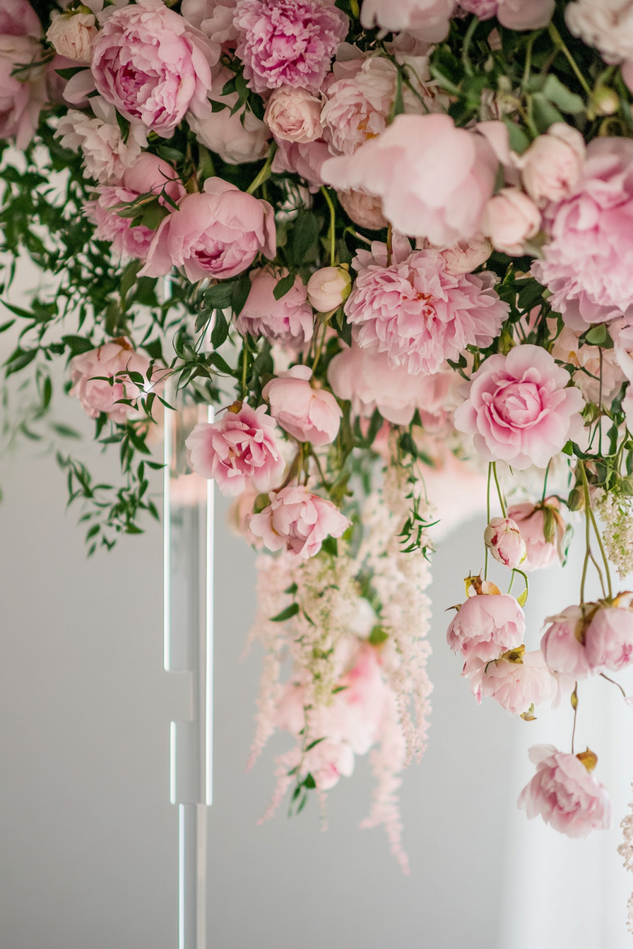 Wedding welcome mirror. Acrylic frame with suspended pink peonies.