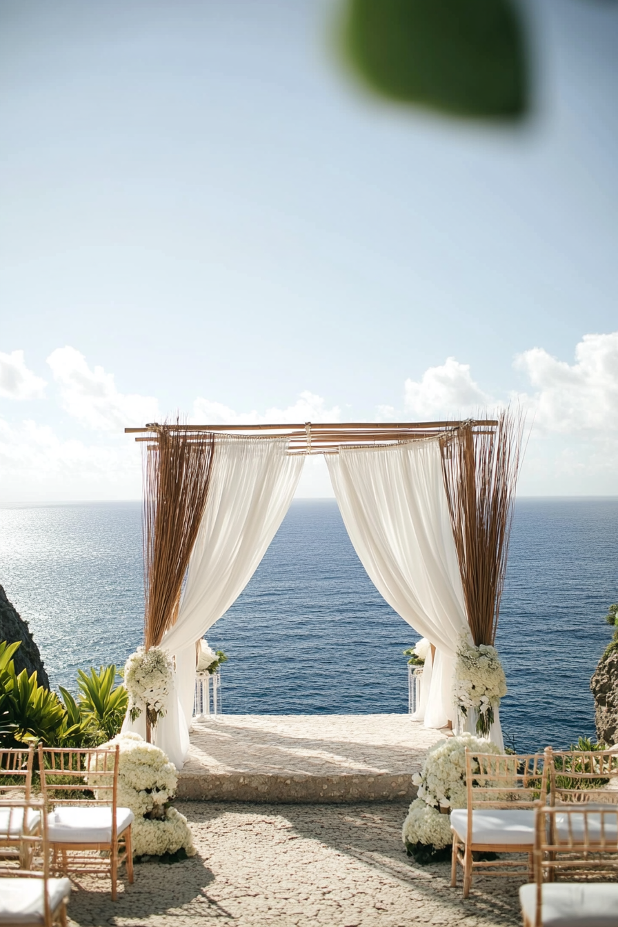 Wedding style. Pearl-white draping and seagrass textures on cliff-addition altar overlooking ocean.